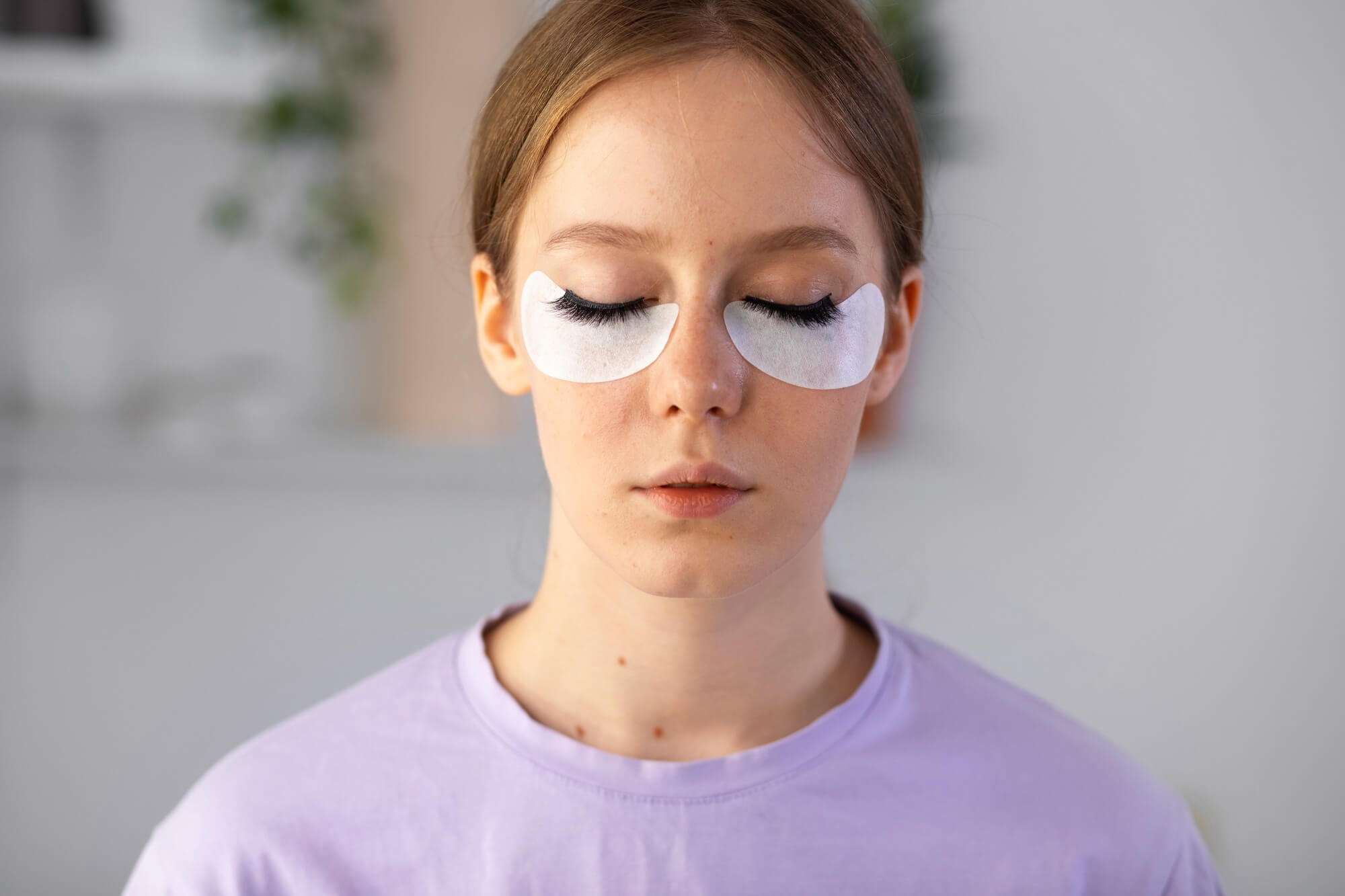 woman-wearing-eye-patches-front-view